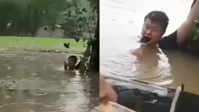 中国の大洪水の中 口にスマホくわえ位置情報を共有し 救助された男性