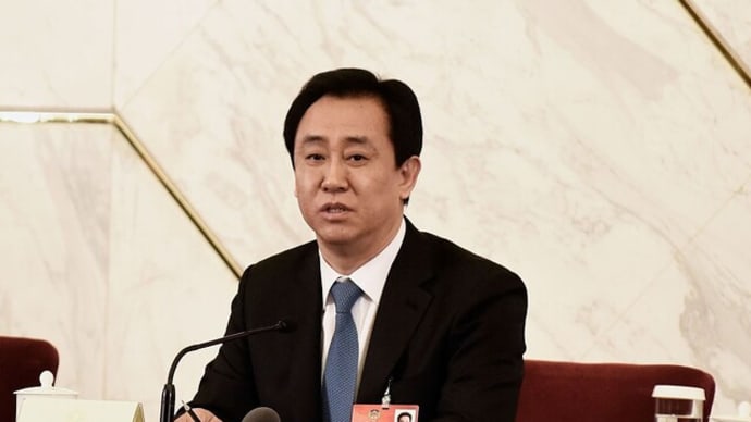 中国不動産大手・恒大集団の会長、警察の監視下に 債務再編にも影響か