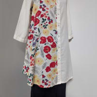 A long blouse with a lively/vibrant pattern.